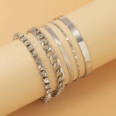 Accessorize like a pro with this silver-plated chain bracelet set that boasts delicate cubic zirconia accents and a sleek cuff. Bracelets 1-4 : 6.3" L with 1.97" extender Cuff : 2.36" diameter Lobster claw clasp Silver-plated copper / cubic zirconia Jewerly Designs, Crystal Chain, Like A Pro, Bracelet Designs, Metal Chain, Bracelet Set, Lobster Claw, Crystal Rhinestone, Womens Bracelets