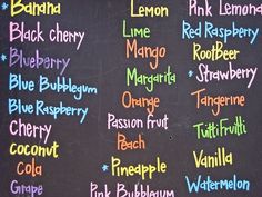 a chalk board with writing on it that says lemonade, blueberry, red raspberry, and orange