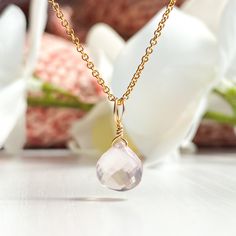 This beautifully simple necklace is lovingly handmade with a stunning AA+ grade Rose Quartz gemstone and a choice of 14k Gold Filled, 14k Rose Gold Filled or Sterling Silver Chain. M A T E R I A L S: * Rose Quartz Heart Briolette  * Grade - AA+ * Origin - Madagascar * 14k Gold Filled, 14k Rose Gold Filled or Sterling Silver Chain S I Z E: *  Pendant - Approximately 8-9mm *  Chain Thickness - Approximately 1.1mm  All of our jewellery is carefully handmade using good quality materials and handpicked gemstones, with the aim to produce quality pieces that you can love & wear for years to come.  R O S E  Q U A R T Z: * Talisman for Taurus, Libra * Heart Chakra Rose Quartz is the stone of universal love. It restores trust and harmony in relationships, encouraging unconditional love. Rose Quartz Dainty Pink Gold Jewelry With Birthstone, Elegant Pink Gold Charm Necklaces For Gifts, Dainty Pink Gold Birthstone Jewelry, Elegant Pink Gold Charm Necklace For Gift, Dainty Pink Gold Gemstone Necklaces, Dainty Pink Gold Jewelry For Everyday, Handmade Rose Gold Briolette Jewelry, Dainty Rose Gold Briolette Necklace, Minimalist Pink Gold Jewelry For Gifts