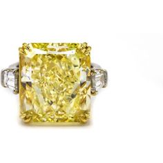 Behold the magnificence of our 20-carat Radiant Cut Diamond Fancy Intense Yellow GIA Ring! This extraordinary piece of fine jewelry is a testament to the timeless beauty and impeccable craftsmanship that our brand stands for. Picture this: a breathtaking 20.67-carat Fancy Intense Yellow diamond, radiating brilliance and grace, set as the centerpiece of this exquisite ring.But that's not all—flanking the center diamond are two bullet-cut high white diamonds, totaling 1.01 carats. These dazzling g Dig Jewelry, Asscher Cut Diamond Ring, Big Diamonds, Fancy Yellow Diamond Ring, Radiant Cut Diamond Ring, Green Diamond Rings, Fancy Diamond Ring, Canary Diamond, Yellow Diamond Ring