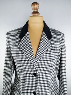 Vintage classic houndstooth blazer from the 90s Black and white blazer in houndstooth pattern Soft, lightweight fabric Black button closure on the front Fully lined 25% wool Immaculate condition Made in Italy Found in a vintage shop in Latvia Size: Medium Measurements when flat: Shoulder to shoulder 18.11 inches (46 cm) Armpit to armpit 20.87 inches (53 cm) Waist 19.29 inches (49 cm) Sleeve 23.23 inches (59 cm) Length 27.17 inches (69 cm) I always dispatch all my items within 1-3 business days P Classic Tailored Houndstooth Blazer, Classic Houndstooth Sport Coat With Suit Collar, Classic Houndstooth Sport Coat, Long Sleeve Houndstooth Blazer For Formal Occasions, Semi-formal Houndstooth Blazer With Suit Collar, Semi-formal Blazer With Houndstooth Pattern And Suit Collar, Classic Long Sleeve Houndstooth Sport Coat, Tailored Houndstooth Blazer, Tailored Houndstooth Blazer With Lapel Collar