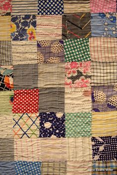 an old patchwork quilt with many different patterns