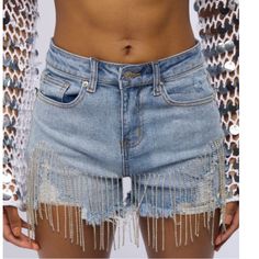 Rhinestone Denim Shorts. Feature A High Rise Waist, A Five-Pocket Design, Functional Belt Loops, Zipper Fly Button Fastening, Slight Distressed Details, Raw Hems, And Glam Rhinestone Fringe Trimming. Waist 13.5” Length 12.5”, Rise 10.25” Alert Label Size Xl But Runs Very Small. It Will Fit Better A Small-Medium, Check Measurements. I’m Posting As A Medium Size. Trendy Denim Blue Bottoms With Rhinestones, Spring Denim Blue Bottoms With Rhinestones, Denim Blue Rhinestone Bottoms For Spring, Denim Blue Rhinestones Bottoms For Spring, Spring Denim Blue Rhinestones Bottoms, High Waist Blue Jeans With Rhinestones, Blue High Waist Jeans With Rhinestones, High-waist Blue Jeans With Rhinestones, Embellished Medium Wash Denim Bottoms