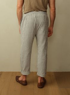 The ultimate vacation pant featuring a drawstring waistband and lightweight double gauze organic cotton. Look your best for long days at the beach, lounging around the hotel, brunch, etc. You get the idea. Fit: Unisex fit. Male model is wearing size M. Female model is wearing size XS. Relaxed fit, tapered leg, drawstring waist. Material: 100% Organic Cotton. Care: Machine wash cold with like color. Tumble dry low. Do not bleach. Cool ironing. Origin: Made in Portugal. Relaxed Fit Pants For Summer Lounging, Relaxed Fit Pants For Lounging In Summer, Casual Linen Lounging Pants, Linen Bottoms With Elastic Waistband For Lounging, Casual Linen Lounging Bottoms, Summer Relaxed Fit Bottoms For Lounging, Comfortable Linen Bottoms For Lounging, Comfortable Linen Lounging Bottoms, Comfortable Lounging Linen Bottoms