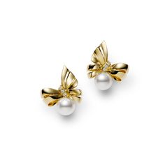 Prized for their brilliant luster and rich color, Akoya pearls are a traditional symbol of elegance and beauty. These MIKIMOTO yellow gold ribbon earrings are accented with an 7mm A+ Akoya pearl and are suspended from a delicately crafted 18k yellow gold bow with diamond accents. MIKIMOTO Style #: MEQ10123ADXK Refined Yellow Gold Pearl Earrings For Anniversary, Elegant Akoya Pearl Earrings In Yellow Gold, Elegant Gold Akoya Pearl Earrings, Elegant Yellow Gold Akoya Pearl Earrings, Gold Akoya Pearl Earrings For Formal Occasions, Refined Yellow Gold Pearl Earrings For Formal Occasions, Exquisite Yellow Gold Pearl Earrings For Formal Occasions, Yellow Gold Pearl Earrings For Evening, Elegant Yellow Gold Pearl Earrings For Formal Occasions