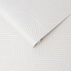 a white wallpaper with wavy lines on it