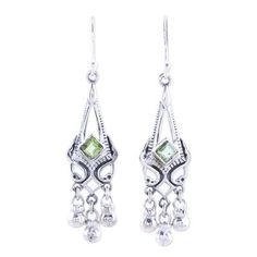 Exude elegance in flashes of green with these exquisite dangle earrings from India's Alok Jain. Sterling silver architectural bezels house two faceted peridot gems. Tiny globes dance beneath creating movement as the wearer moves. Green Chandelier Earrings For Anniversary, Green Faceted Sterling Silver Earrings, Green Nickel Free Dangle Chandelier Earrings, Green Nickel-free Dangle Chandelier Earrings, Green Dangle Chandelier Earrings For Anniversary, Green Dangle Chandelier Earrings For Formal Events, Green Dangle Chandelier Earrings For Formal Occasions, Green Peridot Dangle Earrings, Silver Peridot Drop Earrings