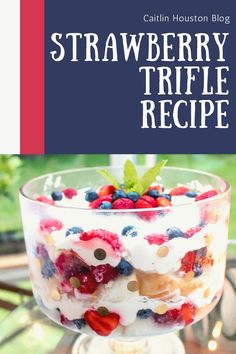 a trifle dish with berries and blueberries in it on top of a table