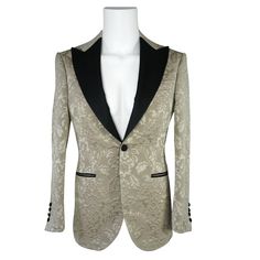 Champagne Oro Designer Fiore Fabric Woven In France Satin Black Signature Peak Lapel Single Button Closure Soft, natural shoulder construction Chest Barchetta Pocket Dual Vents Satin covered buttons in black Handmade in any size! Includes a Sebastian Cruz Couture Pocket Square of your choice! All of our jackets are made with 4" extra of fabric to ensure you don't have to send it back to us if its too small or too big. You can tailor your jacket 2 sizes bigger and/or smaller if needed. We guarant Luxury Formal Tuxedo With Button Closure, Luxury Tuxedo With Button Closure For Formal Events, Luxury Tuxedo With Button Closure For Formal Occasions, Elegant Blazer With Notch Lapel And Horn Black Buttons, Luxury Party Blazer With Button Closure, Elegant Winter Blazer With Horn Royal Black Buttons, Luxury Formal Outerwear With Covered Buttons, Evening Tailored Blazer With Covered Buttons, Party Fitted Blazer With Covered Buttons