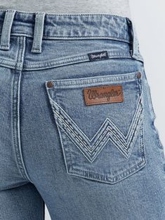 Like all Wrangler Retro jeans, our Mae wide leg trouser jean is marked by its Western authenticity, making it a go to style for cowgirls everywhere. With its contour waist and mid rise fit, these women's trouser jeans are made to fit comfortably while they flatter all your curves. With more room at the knee and gradual opening down the leg, the Mae wide-leg trouser gives you the room you need to stay active and in style. Fit: Relaxed Rise: Mid Front Rise: 8 5/8" Leg: Trouser Leg Opening: 20 1/2" Wrangler Riding Jeans, High Waisted Western Jeans, Country Jeans Womens, Cute Country Jeans, Wrangler Womens Jeans, Cute Western Jeans, Jeans With Pocket Design, 7s Jeans, Cowgirl Fits