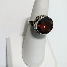 925 Sterling Silver Artisan Crafted Red Stone Ring. Never Worn. Formal Red Crystal Ring, Elegant Red Sterling Silver Ring, Elegant Red Crystal Round Ring, Elegant Faceted Ruby Ring, Elegant Faceted Round Ruby Ring, Elegant Red Round Crystal Ring, Adjustable Formal Ruby Gemstone Ring, Sterling Silver Ruby Ring With Vs Clarity For Gift, Classic Adjustable Red Ring