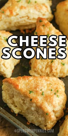 cheesy scones on a baking sheet with text overlay that reads cheese scones