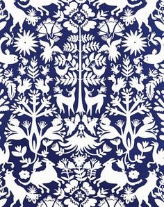 an intricately designed blue and white wallpaper with deers, plants and flowers