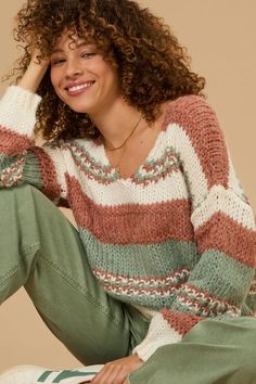 This knit oversized striped sweater combines relaxed fit with bold stripes for a stylish look. Its cozy texture and generous silhouette make it perfect for layering and staying warm. White Dress Skirt, Cute Sweaters For Fall, Knit Oversized Sweater, Cozy Texture, Oversized Striped Sweater, Christmas Skirt, Skirts With Boots, Winter Layering, Oversized Knitted Sweaters