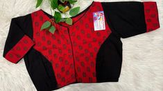 Introducing our elegant red and black combination pure cotton blouse, a perfect addition to your wardrobe. This size 38/40 blouse features a front opening and a high neck design, providing both style and comfort. The block print in red and black adds a stunning touch to this classic piece, making it versatile for both casual and formal occasions. Plus, with a good margin inside, we offer the option to alter for the next size, ensuring a perfect fit for every customer. Don't miss out on this stylish and timeless cotton blouse - shop now and elevate your wardrobe! Black Block Print Cotton Tops, Red Cotton Workwear Tops, Red Cotton Tops For Work, Fitted Cotton Blouse Piece With Block Print, Traditional Red Block Print Top, Black Cotton Blouse For Work, Traditional Black Cotton Blouse, Traditional Black Cotton Top, Traditional Black Block Print Blouse