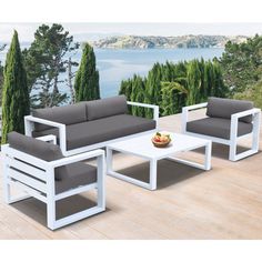 an outdoor furniture set on a wooden deck