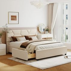 a bedroom with white walls and wooden floors