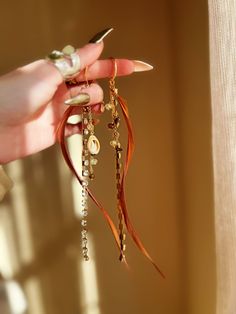 This listing is for a pair of neutral feather earrings embellished with gemstone chain and boho charms. Boho Charms, Quartz Point Necklace, Earrings Feather, Tiered Necklace, Teal Earrings, Earrings Dangling, Ceramic Necklace, Feather Jewelry, Hanging Earrings