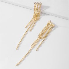 Exquisitely accent your ensembles with these earrings crafted from lustrous metal. Embellished with shimmering cubic zirconia. 0.51" W x 3.54" L 18k gold-plated copper / cubic zirconia Tassel Drop Earrings, Earring Crafts, Beaded Tassels, Cubic Zirconia, Tassels, Gold Bracelet, 18k Gold, Gold Plate, Copper