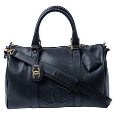 Step into the glamorous world of Chanel with this iconic vintage Chanel small weekender which could also be used as a daily carry. Crafted from luxurious black calfskin leather, this statement piece exudes elegance. The sleek black leather straps effortlessly complement the striking 24K gold hardware, adding a touch of opulence. It offers ample space for all your essentials. This iconic design, produced between 1994 and 1996, comes complete with its auth card, straps, keys in clochette, cadenas, and CC charm. Be prepared to turn heads and indulge in the timeless allure of Chanel! SPECIFICS Length: 13.78 inches Height: 9.45 inches Width: 7 inches Handle Drop: 5 inches Authenticity Code: 3496649 (1994 - 1996) Comes with: Authenticity card, strap, keys in clochette, cadenas, charm Chanel 1994, Daily Carry, Black Caviar, Iconic Design, Vintage Chanel, Fashion Handbags, Gold Hardware, Icon Design, Calf Skin