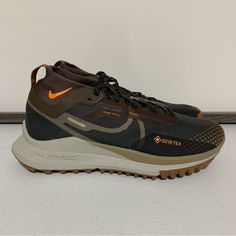 Nike React Pegasus Trail 4 Gore-Tex Sneaker Running Shoes -Size 6 Men’s (7.5 Women’s) -Anthracite/Light Mandarin/Iron Stone -Hit The Ground Running -Low-Profile Design -Pull Tab For Easy Entry -Lace-Up Fastening -Sock-Like Cuff -Signature Nike Branding -React Foam Midsole Provides Ultra-Responsive, Springy Cushioning -Durable Rubber Outsole -Shockwave-Like Pattern Tread -New With Tags -New Without Box Nike Outdoor Walking Shoes With Round Toe, Nike Walking Shoes With Round Toe For Outdoor, Nike Trail Running Shoes With Round Toe, Nike Trail Running Shoes With Laces For Outdoor, Functional Brown Running Shoes With Round Toe, Brown Breathable Sneakers For Running, Brown Breathable Running Sneakers, Nike Low-top Hiking Boots With Vibram Sole, Nike Brown Running Shoes For Sports