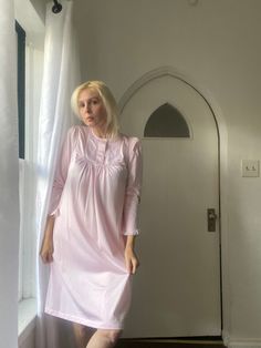 "80s Shadowline nightgown. Made in USA. Soft Pink color with 3 button closure on bodice that has a bib design. Pretty lace detail on bodice & sleeves. Small floral appliqués on bib. Pullover style. Nylon fabric. Has a warm fleece like feel. Size small. Good condition.  Flat Measurements:  14\" shoulder to shoulder  17\" pit to pit  38\" length  22\" sleeve" Long Sleeve Buttoned Nightgown, Long Sleeve Buttoned Nightgown For Bedtime, Long Sleeve Nightgown With Lace Trim For Sleepover, Feminine Fitted Long Sleeve Nightgown, Fitted Long Sleeve Nightgown, Fitted Long Sleeve Nightgown For Sleep, Spring Long Sleeve Nightgown With Lace Trim, Spring Long Sleeve Lace Trim Nightgown, Vintage Fitted Nightgown For Sleep