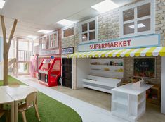 an indoor play area with toys and furniture