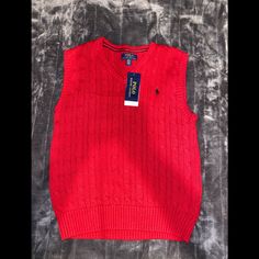 This Layering Piece Gets A Polo Ralph Lauren Upgrade With Soft Combed Cotton And Ralph Lauren's Signature Embroidered Pony. Cotton V-neck Top For School, Casual V-neck School Tops, Casual V-neck Tops For School, Red Winter Top For School, Red Fall Tops For School, Polo Sweater Vest, Polo Ralph Lauren Vest, Ralph Lauren Vest, Cotton Cable Knit Sweater