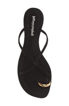 A metallic toe loop and interlocking vamp straps create contemporary allure on a leather slide sandal that will complement your trendsetting style. Flat sole Leather upper and lining/synthetic sole Imported