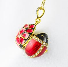 "Locket Ladybug with the guardian angel inside, enameled and 24K gold plated over solid sterling silver, created in the spirit and tradition of Faberge jewelry in our NJ shop. The front of the pendant is designed as a bug with a black head and red wings and in the back large pink - red flowers emerge from the black surface. High quality clear crystals are set at the center of the flowers and in the lines separating the head and the wings  from each other.   The pendant is about 0.9\" (20 mm ) wi Red Flower Necklace, Faberge Jewelry, Jewelry Lockets, Pretty Pendant, Jewelry For Her, Enamel Jewelry, Guardian Angel, Lucky Charm, Turquoise Jewelry