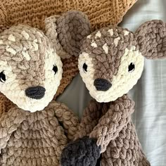 two crocheted teddy bears sitting next to each other