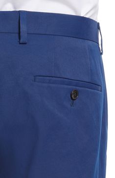 Crisp, classic and versatile, these staple flat-front chinos sport a handsomely tailored fit and a creased finish that keep them smart styled up or down. 14" leg opening; 10" front rise; 15" back rise (size 32) Zip fly with hook-and-bar closure Front slant pockets; back button-welt pockets Partially lined Unhemmed. Get the perfect fit—book an appointment with one of our alterations experts 100% polyester Dry clean Made in Turkey Men's Clothing Business Chinos With Straight Hem And Belt Loops, Business Chinos With Belt Loops And Straight Hem, Fitted Solid Color Chinos With Welt Pockets, Formal Chinos With Straight Hem And Belt Loops, Chino Cotton Twill Dress Pants With Welt Pockets, Formal Flat Front Chinos With Belt Loops, Business Casual Chinos With Welt Pockets And Flat Front, Cotton Dress Pants With Pressed Crease And Flat Front, Formal Chino Cotton Twill Pants With Welt Pockets