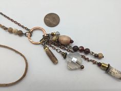 "A little rustic, a little boho... this beautiful long boho necklace features orange, rust color agate 6mm stones, plus brass, wood and antiqued copper. Each natural Stone is a slightly unique. 28\" antiqued copper chain. Approx. 32 to 33 inches length total. If you need a different length, please note in in notes to seller near the end of completing your order. Custom lengths are welcome. This length falls mid chest on an average medium size woman. Red agate promotes safety, grounding & vit Bohemian Brown Wire Wrapped Necklaces, Bohemian Brown Copper Necklaces, Bohemian Long Brown Necklace, Bohemian Brown Long Necklace, Brown Bohemian Long Necklace, Bohemian Rust Necklace With Natural Stones, Bohemian Rust Necklaces For Gift, Adjustable Rust Bohemian Necklace, Handmade Rust Bohemian Necklace