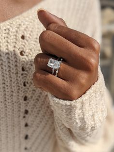 a close up of a person wearing a ring