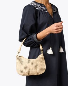 Clare V.'s Moyen bag is sure to be your new go-to. The messenger silhouette is crafted from woven rattan in a neutral cream hue and boasts stunning functional details like interchangeable shoulder and crossbody straps, and a roomy interior to hold all of your essentials. Style yours with ladylike dresses and sleek separates alike to effortlessly complete any look. Chic Beige Crochet Bag With Woven Leather Details, Chic Beige Crochet Bag With Woven Leather, On-the-go Natural Hobo Shoulder Bag, Beige Bucket Bag With Intrecciato Weave For Vacation, Vacation Shoulder Bag With Woven Leather And Round Handle, Vacation Beige Shoulder Bag With Intrecciato Weave, Vacation Shoulder Bag With Intrecciato Weave And Double Handle, Chic Beige Woven Leather Bucket Bag, Chic Woven Leather Straw Bag With Top Handle