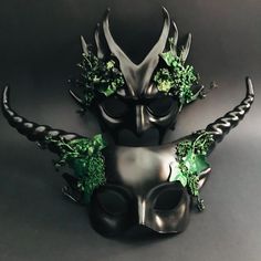 Adorned with intricate horn details and lush foliage, this mask set embodies the spirit of the forest. Be the best dressed at the ball, Halloween party, or any other event with these masks! Age Group/Gender - Adult/Unisex Size/Type - One size fits all adults Mask Material - Polyresin Accent Material - Paint Special Features - Forest embellishments Forest Masquerade, Green Masquerade Mask, Goth Mask, Mardi Gras Kid, Kids Party Packs, Couples Masquerade Masks, Masquerade Ball Masks, Spirit Of The Forest, Masks Halloween