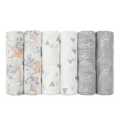 six baby swaddles in various colors and designs, all lined up on top of each other