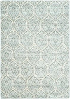 a blue and white rug with an intricate design