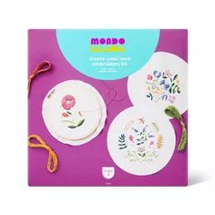 the kit includes three embroidery kits and scissors