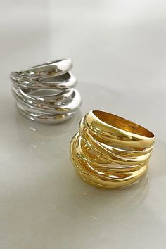 Handcrafted in Italy of 21k gold-plated sterling silver and sterling sliver, these dazzling gold and silver rings showcase a soothing, sculpted design. This aesthetic masterpiece is an interpretation of a traditional stack. The intricate flowing detail and light weight makes it perfect for everyday casual as well as dress. Each ring is handmade by Italian artisans, in small quantities, while reducing waste. 21K Gold Vermeil; .925 Sterling Silver Tarnish Resistant Hypoallergenic Height: 3/4" Sust Silver Circle Earrings, Reducing Waste, Special Ring, How To Clean Metal, Gold And Silver Rings, Italian Jewelry, Circle Earrings, Gold Plated Sterling Silver, Gold And Silver