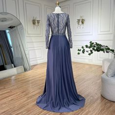 a dress is displayed on a mannequin in a room