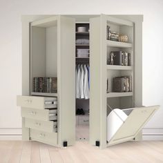 an open closet with shelves and drawers in it