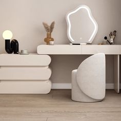 a white desk with a mirror on top of it