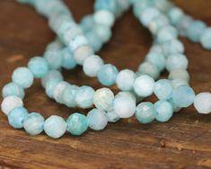 Of the many Amazonite gemstone bead varieties we carry, Brazil Amazonite beads strike us as the most cheerful. Maybe it’s all of that warm weather in Brazil, maybe it’s the vibrant aqua color, but whatever it is, these beauties are sure to stun. Often bright aqua, these semi-opaque, blue-green Brazil Amazonite stones also have softer whiteish inclusions and darker spots that add natural variety to each gemstone strand.  Though these stones were mined in Brazil, they are not truly of the Amazon. Faceted Turquoise Beaded Bracelets, Turquoise Faceted Beaded Bracelets, Amazonite Gemstone Beaded Necklaces With Round Beads, Amazonite Gemstone Beaded Necklace With Round Beads, Aquamarine Beaded Bracelets With Natural Stones, Amazonite Gemstone Beaded Necklace, Beaded Aquamarine Bracelets With Natural Stones, Artisan Amazonite Round Bead Necklace, Everyday Amazonite Round Beads Jewelry