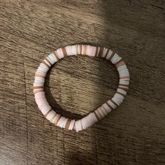 A Handmade Claybead Bracelet With Pink White And Tan Brown Clay Bracelet Ideas, Pink Clay Bracelet Ideas, Grey Clay Bead Bracelet, Cream Round Beads Bracelets For Beach, Cream Bracelets With Round Beads For Beach, Clay Bead Bracelet Pink, Country Bracelets, Make Clay Beads, Clay Bead Necklace