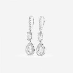 These multi shaped diamond drop earrings are a true symbol of Badgley Mischka's glitz and glam style. Lab grown diamonds are hand set to perfection bringing out the true charm of the design. Luxury Pear-shaped Diamond Evening Earrings, Pear-shaped Evening Diamond Earrings, Dazzling Formal Bridal Earrings With Pave Setting, Dazzling Bridal Earrings With Pave Setting For Evening, Formal Pear-shaped Diamond Bridal Earrings, Elegant Pear-shaped Chandelier Earrings For Formal Occasions, Formal Teardrop Chandelier Earrings With Diamond Accents, Teardrop Chandelier Earrings With Diamond Accents For Formal Occasions, Luxury Pear-shaped Earrings With Pave Setting