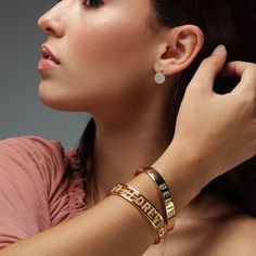 A hot trend this year, you can't go wrong with this gold plated piece. A beautiful cuff bracelet to start off your collection in the best possible way and leave everyone green with envy! The letters that make up the word "FOREVER" are floating inside and they are decorated with clear cubic zirconias. This bangle makes a sweet and personal statement that is a perfect gift for yourself, family, friends, or loved ones. - Stones Material: Cubic Zirconia.- Stones Shape: Round.- Metal: Brass.- Plating Gold Friendship Bracelet With Meaningful Style, Gold Name Bracelet For Friendship, Meaningful Gold Jewelry For Friendship, Gold Promise Bangle Name Bracelet, Gold Bangle Name Bracelet For Promise, Meaningful Gold Jewelry For Promise, Meaningful Gold Promise Jewelry, Meaningful Gold Bracelet, Meaningful Gold Cuff Bracelet As Gift