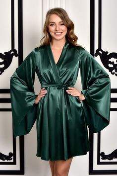 "All bridal robes https://etsy.me/31Q2MMY This is the gorgeous, extremely beautiful kimono robe, made of green stretch satin. The wide sleeves add elegance and exquisite beauty. This satin kimono is perfect for a bridal party to relax and celebrate your upcoming wedding with your maids of honor. It's also an ideal getting ready bridal dressing gown on one of the most important mornings of the bride when she'd like to look immaculate and posh. Let it embrace you with its light and tender fabric a Bachelorette Party Robes, Robe For Bride, Wedding Kimono Robe, Long Bridal Robe, Silk Bridal Robe, Bridal Dressing Gown, Satin Bridal Robe, Satin Dressing Gown, Lace Bridal Robe