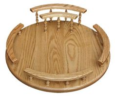 an image of a wooden board with handles and teeth on the back side, as if it were carved out of wood