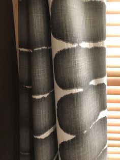 a curtain with black and white designs on it